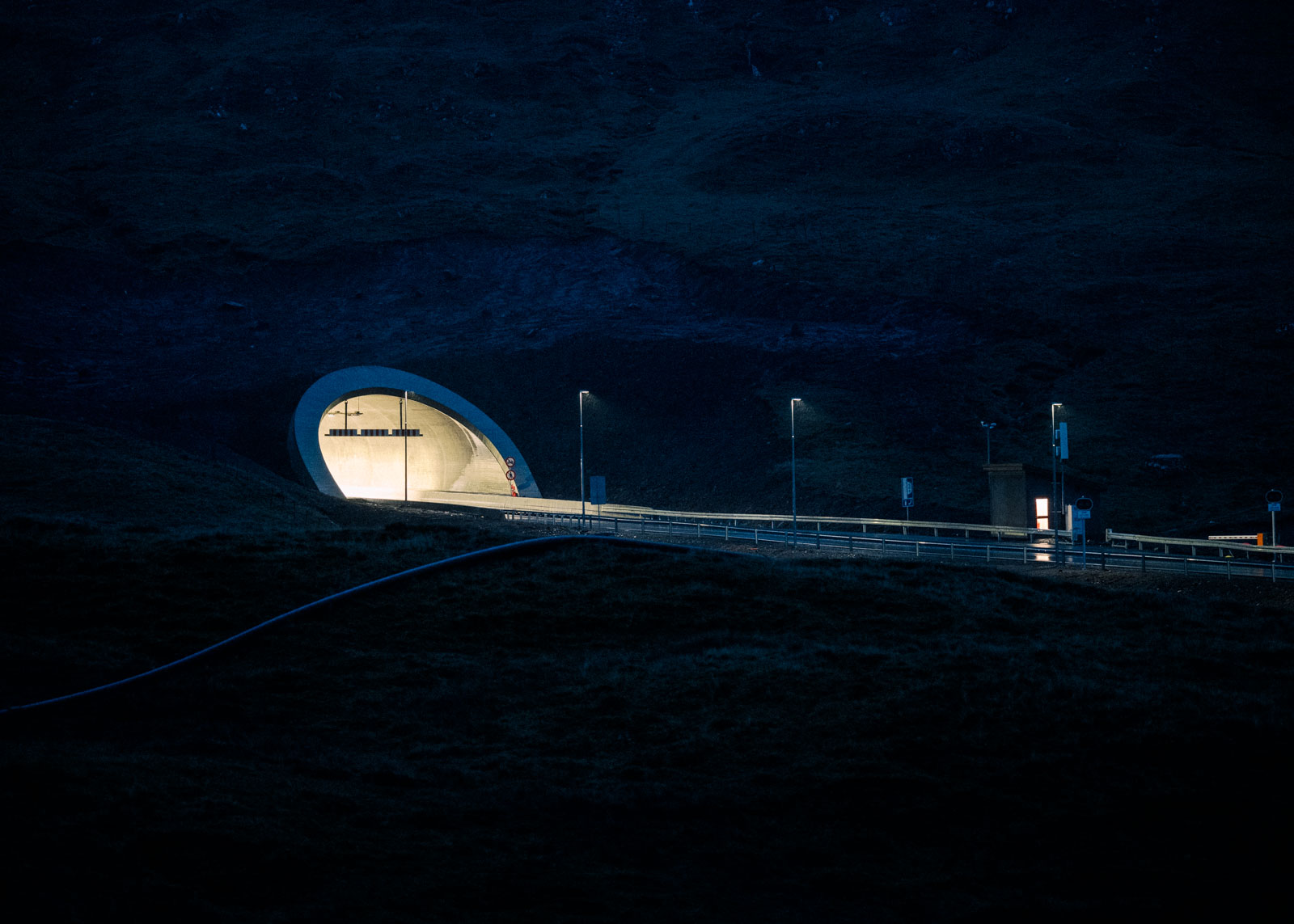 Sandoyartunnilin at night, Faroese Island on January 30th, 2024. The 10.7km long Subsea tunnel just recently opened, connecting Sandoy with its 1200 inhabitants to the rest of the island and essentially transforming it into a suburb of the capital, Tórshavn. This might not be immediately felt by the people of Tórshavn but marks a significant change for the residents of Sandoy. 30.01.2024, Sandoy, Faroe Island, ©2024 Niclas Tiedemann